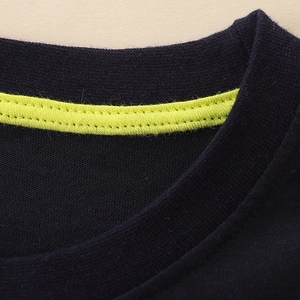 Cotton long sleeve T-shirt featuring navy blue ribbed crewneck and lime green contrast piping