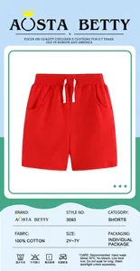 Detail of red cotton boys sports shorts featuring elastic waistband and white drawstring