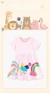 Detail of pink cotton girl dress with vibrant rainbow and sun cartoon print designs