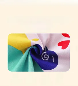 Close-up of colorful cartoon heart print fabric showing breathable mixed material texture