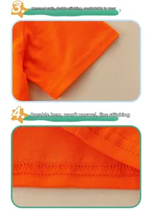 Detail of double-stitched hem and sleeves on orange cotton t-shirt for boys