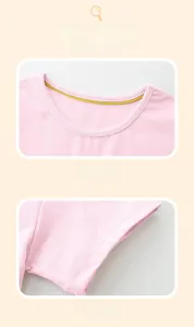 Detail of pink cotton knit top with yellow neck binding and precise double-stitched sleeves