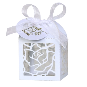 Laser cut white rose gift box with silk ribbon and gold Thank You gift tag for weddings