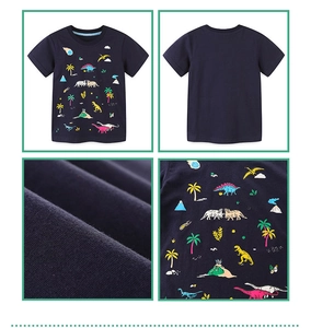 Close-up of high-quality navy cotton fabric with colorful dinosaur and tropical prints
