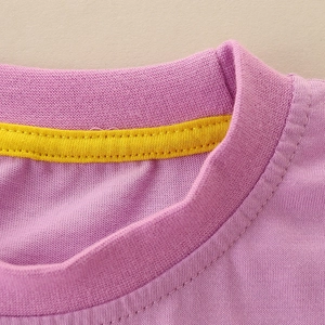 Girls' purple cotton T-shirt featuring a ribbed round neck and yellow reinforced inner binding