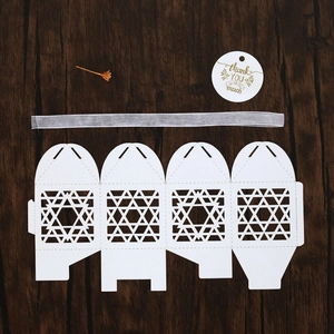 Laser-cut white gift box template with star pattern, ribbon and thank you tag