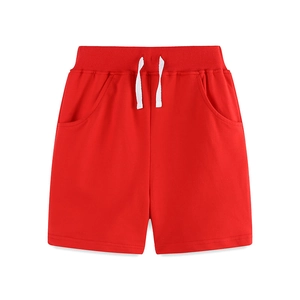 Solid red knit cotton shorts for boys with elastic drawstring waist and side pockets