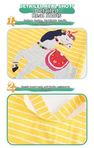Close-up of yellow striped cotton girl dress with horse embroidery and sequins