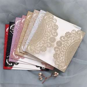 Detailed laser-cut glitter wedding invitation covers in seven elegant assorted colors