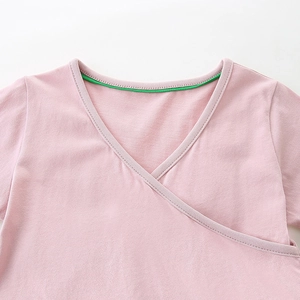 Pink V-neck knit baby dress with cartoon embroidery and stylish contrast green piping trim