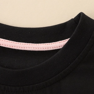 Boys black cotton knit t-shirt featuring a contrast pink reinforced crew neck detail