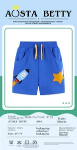 Detail of blue cotton boy shorts featuring rocket embroidery and yellow drawstring