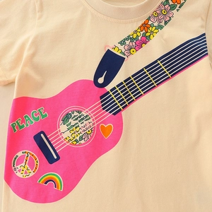 Girls cotton T-shirt featuring a colorful guitar print and peace sign on cream fabric