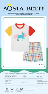 Detail view of 100% cotton girls summer set with white unicorn T-shirt and plaid shorts