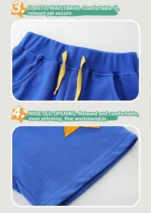 Detail of high-elastic waist with yellow drawstring and star embroidery on blue shorts