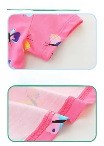 Close-up of high-quality double-needle stitching on the hem of pink butterfly dress