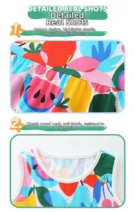 Detail shot of round neckline and soft cotton knit fabric with colorful fruit prints