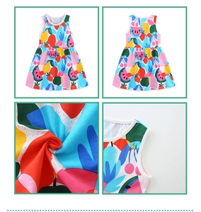 Detail of girl's cotton dress showing colorful fruit prints and high-quality stitching