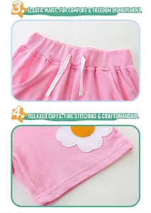 Dettaglio pantaloncini in cotone da bambina con elastico in vita e ricamo a margherita