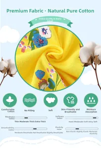 Détail du tissu en coton jaune doux avec imprimés floraux pour robes de filles