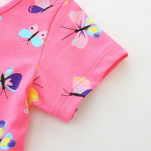 Pink cotton girls butterfly print dress with short sleeves and vibrant summer pattern