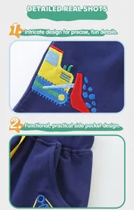 Close-up of boys dark blue knit shorts with colorful excavator embroidery and side pocket