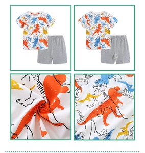 Macro detail of breathable knit cotton fabric and colorful cartoon dinosaur prints on kids set