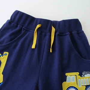 Dark blue boys shorts with yellow drawstring and cartoon construction embroidery