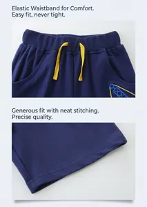 Detail of kids navy shorts showing elastic waist with yellow drawstring and fine stitching