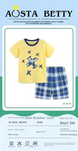 Detail of boys' yellow cotton T-shirt with airplane print and blue checkered shorts set