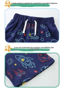 Detail of kids navy cotton shorts featuring space prints and elastic drawstring waist