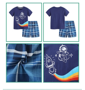 Detail of boys navy cotton T-shirt with astronaut print and matching plaid shorts set