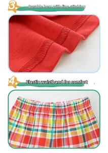 Detail of red knitted cotton hem with double stitching and elastic plaid waistband