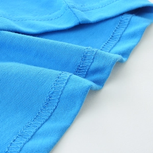 Close-up of blue cotton knit boys t-shirt showing high-quality double-needle stitching