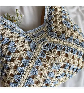 Close-up of sky blue and cream woven crochet pattern with a soft brown inner lining