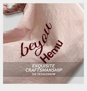 Close-up of pink canvas tote bag with folded texture and beyou Hemu artistic lettering