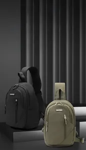 Detail view of water-resistant nylon sling bags in black and olive green with metal zippers