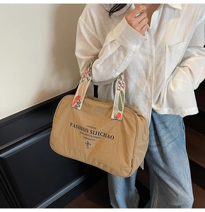 Khaki nylon tote bag with colorful embroidered straps and London fashion print details