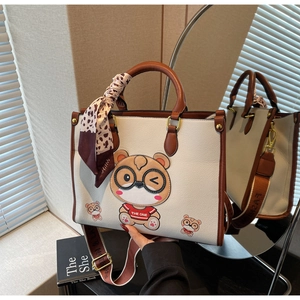 Detail of cute bear tote bag with leopard scarf and adjustable wide shoulder strap