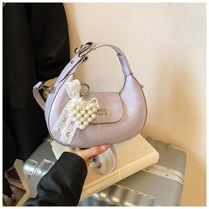 Detail of lavender wrinkled leather hobo bag with heart pearl lace charm and silver hardware