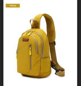 Detail view of yellow nylon chest bag with scratch-resistant texture and khaki strap