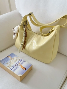 Minimalist large capacity crescent shoulder bag in creamy yellow crocodile pattern leather