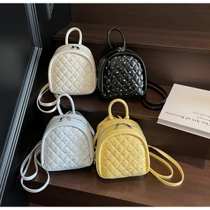 Quilted mini backpacks in four colors with sparkling rhinestone accents and glossy finish