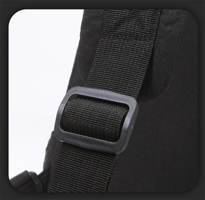 Close-up of high-density nylon strap with black plastic buckle and reinforced stitching
