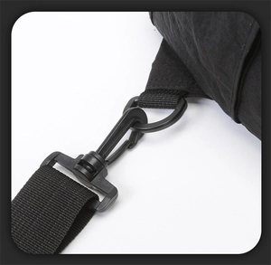 Detail view of the durable black plastic swivel hook and high-density nylon strap