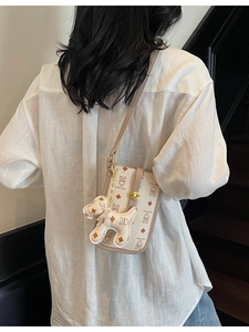 Cartoon teddy bear pattern shoulder bag in cream white faux leather with golden buckle
