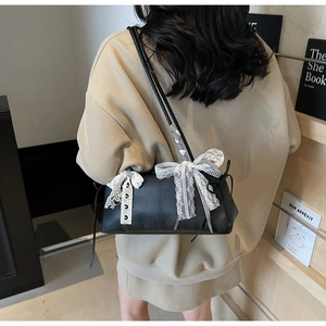 Lace bow and checkered ribbon detail on black textured leather shoulder bag for women