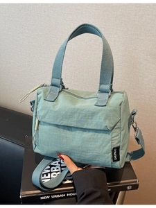 Sage green pleated nylon handbag with detachable strap and top handles for women