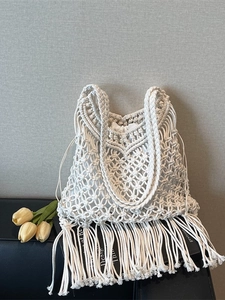 Bohemian white hand-woven tote bag with long tassels and comfortable cotton rope handles