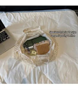 Detailed interior of woven mesh tote bag showing large capacity for phone and wallet